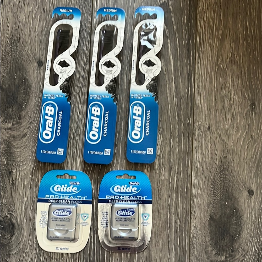 Lot of 5 NEW Oral B products: toothbrushes and floss